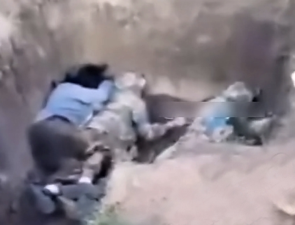 UA soldiers execute 2 traitors and an alleged female collaborator