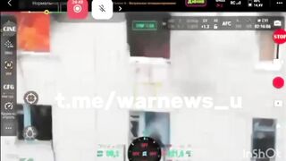 A Russian soldier jumps from the third floor of a burning flat