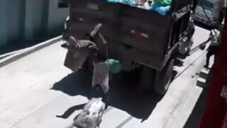 Garbage Truck Worker Tumbles to the Ground in Heart-Stopping Fall