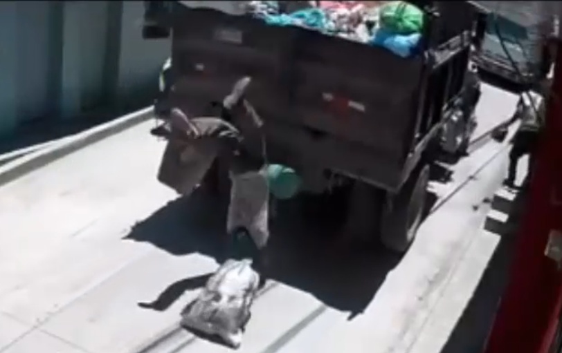 Garbage Truck Worker Tumbles to the Ground in Heart-Stopping Fall