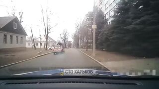 A Ukrainian is trying to get away from persistent policemen in Kharkov