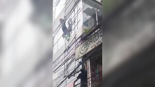 Painter Falls from Third Floor, Electrocuted in Mid-Fall and Smashes onto Pavement