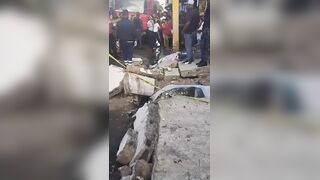 Two Killed Instantly When Massive Concrete Wall Collapses Onto Sidewalk