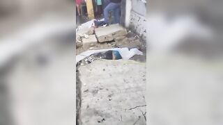 Two Killed Instantly When Massive Concrete Wall Collapses Onto Sidewalk