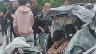 One Dead After BMW Crashed Ino A Parked Truck In China