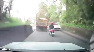 Motorcyclist Dies After Losing Control While Overtaking & Being Crushed by Sand Truck