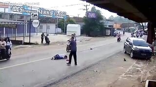 Foolish Biker Loses Control and Dies Under Truck Wheels