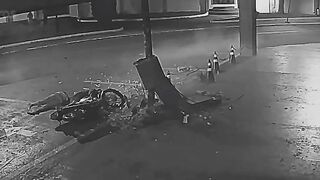 Motorcycle Couple Flees Police Checkpoint, Crashes into Concrete Pillar