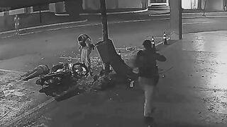 Motorcycle Couple Flees Police Checkpoint, Crashes into Concrete Pillar