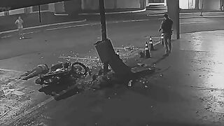 Motorcycle Couple Flees Police Checkpoint, Crashes into Concrete Pillar