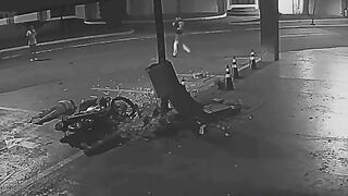 Motorcycle Couple Flees Police Checkpoint, Crashes into Concrete Pillar
