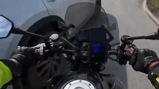 Motorcyclist thrown under the wheels of another car after collision with a car