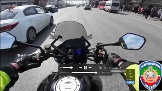 Motorcyclist thrown under the wheels of another car after collision with a car