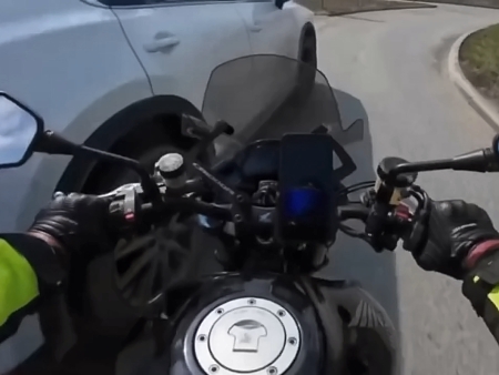 Motorcyclist thrown under the wheels of another car after collision with a car