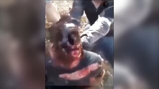 Classic One of the cartel members had his face burned and disfigured.