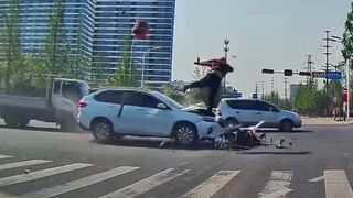 Scooter Delivery Man Seriously Hurt After SUV Collision at Busy Intersection