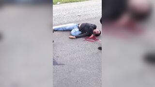 Motorcyclist Bleeding From Mouth After Falling On Road Head First