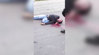 Motorcyclist Bleeding From Mouth After Falling On Road Head First