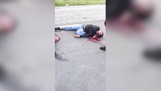 Motorcyclist Bleeding From Mouth After Falling On Road Head First