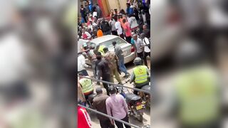 Phone Snatcher Attacked By Mob As Cop Tries To Shield Him