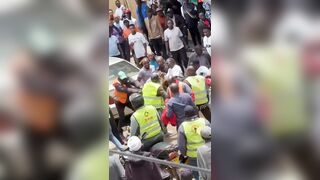 Phone Snatcher Attacked By Mob As Cop Tries To Shield Him