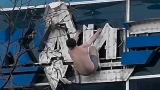 Half-naked man on the sign of Kazan Aviation University