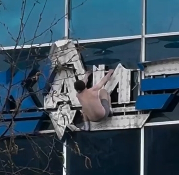Half-naked man on the sign of Kazan Aviation University
