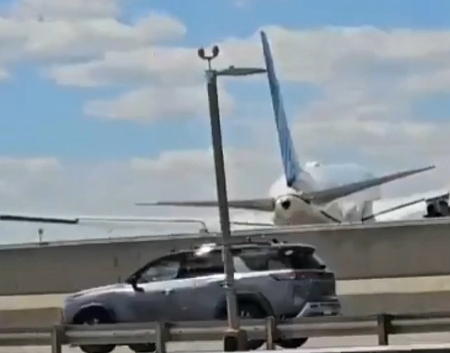 Plane landing gear hits roof of truck (2 Videos)
