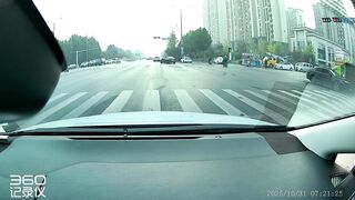 Motorcyclist flung into car trunk after high-speed crash at red light in China