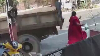Woman Taken Out By Reversing Truck