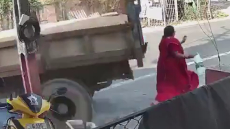 Woman Taken Out By Reversing Truck