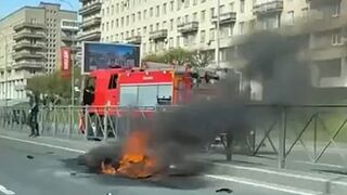 Biker falls, motorbike catches fire