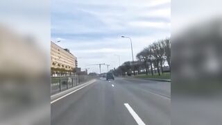 Biker falls, motorbike catches fire