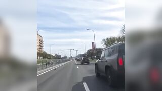 Biker falls, motorbike catches fire