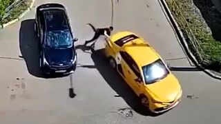 Man on electric scooter crashes into taxi