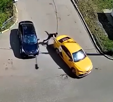 Man on electric scooter crashes into taxi