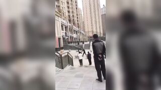 Woman Jumps From A Residental Building In China