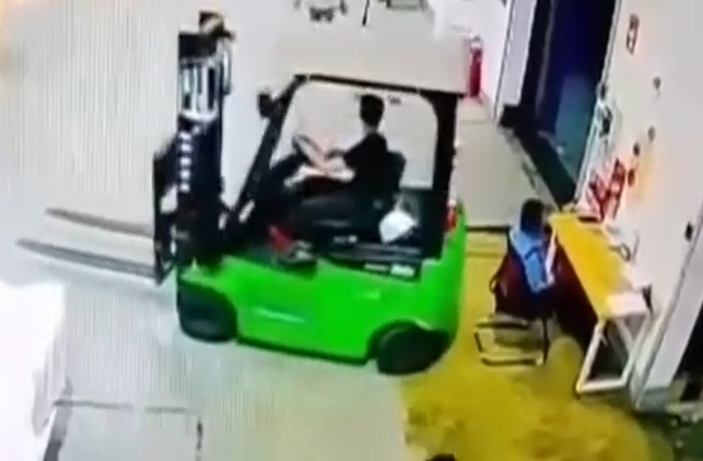 A Forklift Driver Crushes Coworker Against Concrete Wall in Reverse