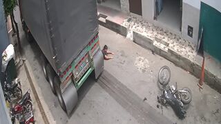Motorcyclist Dragged Under Truck Wheels in Brutal Accident Caught on Camera