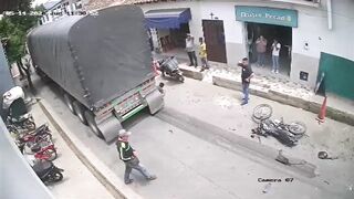Motorcyclist Dragged Under Truck Wheels in Brutal Accident Caught on Camera