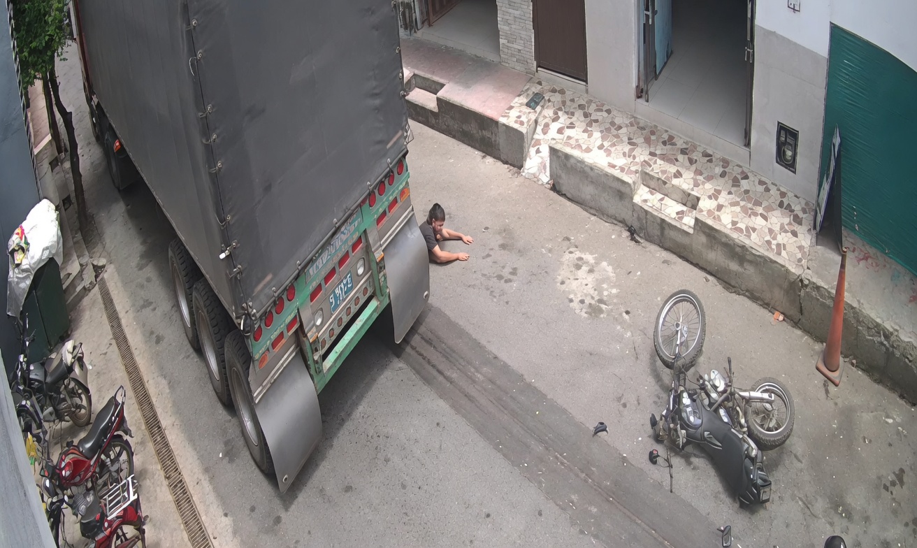 Motorcyclist Dragged Under Truck Wheels in Brutal Accident Caught on Camera