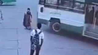 India: Woman killed by bus after ignoring traffic rules.