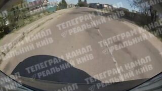 Car sends scooter teens flying close up in Kyiv Ukraine (Novi Petrovtsi)