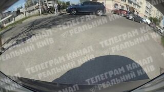 Car sends scooter teens flying close up in Kyiv Ukraine (Novi Petrovtsi)