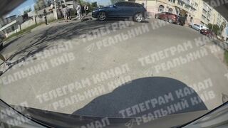 Car sends scooter teens flying close up in Kyiv Ukraine (Novi Petrovtsi)