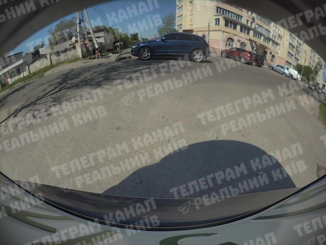 Car sends scooter teens flying close up in Kyiv Ukraine (Novi Petrovtsi)
