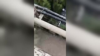 Cellphone Camera  Captures A Moment When Depressed Guy Jumps From The Tall Bridge