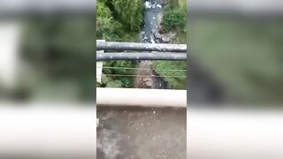 Cellphone Camera  Captures A Moment When Depressed Guy Jumps From The Tall Bridge