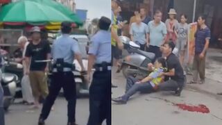 Lunatic Stabs Traffic Cop Before Police Standoff In China