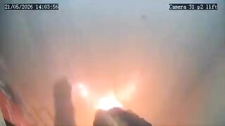 A portable charger explodes inside an elevator, leaving a woman trapped in the flames